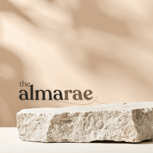 The Almarae wordmark over a stone slab on a warm beige background